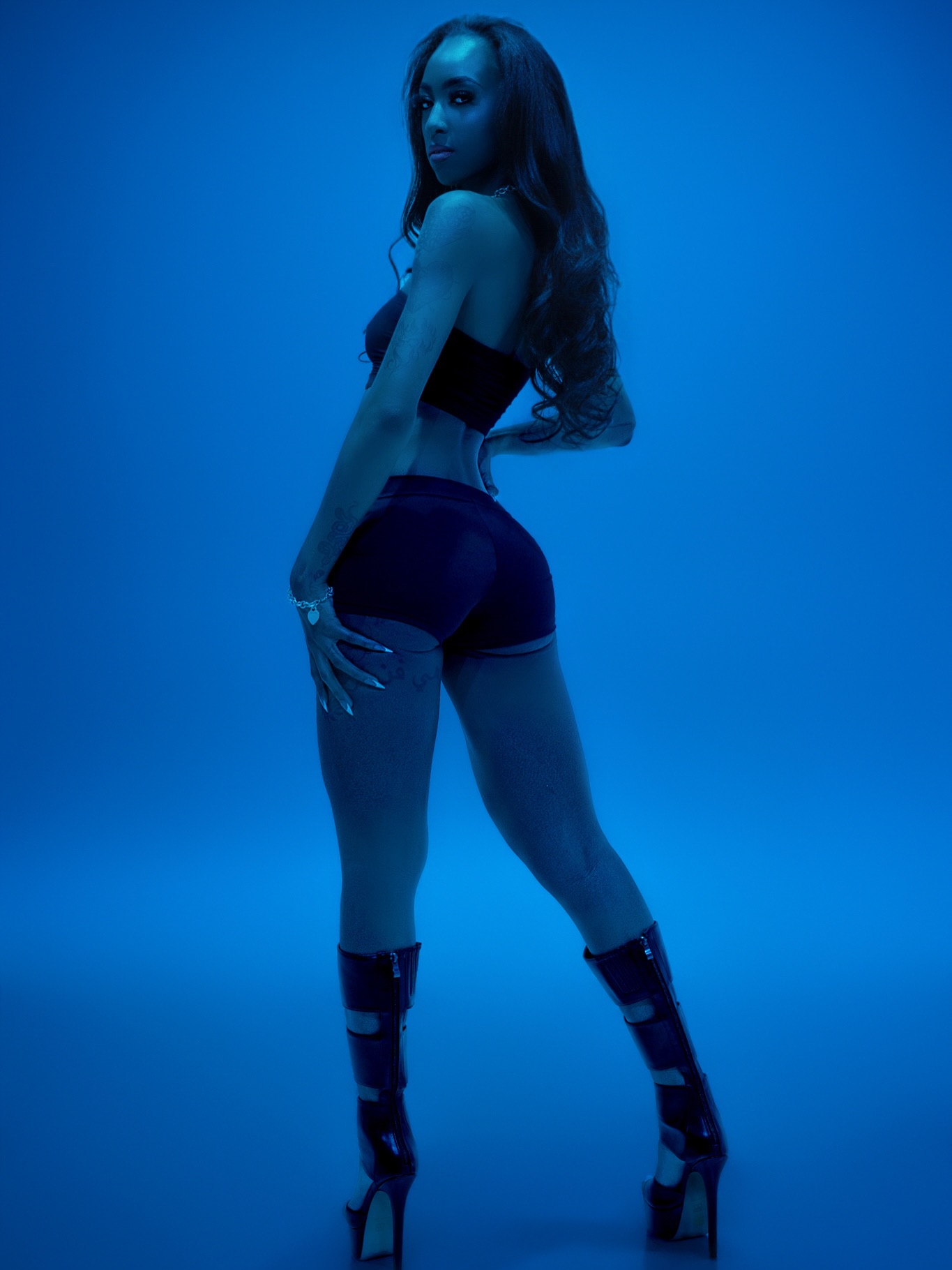 Photo by Eric 📸 on May 07, 2026. May be an image of one or more people, makeup, high-heeled shoes and fishnet stockings.